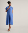 Model is wearing UNTUCKit Linen Francesca Dress in navy. 