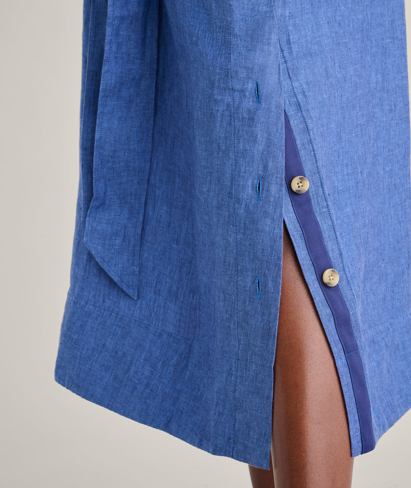 Model is wearing UNTUCKit Linen Francesca Dress in navy. 