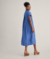 Model is wearing UNTUCKit Linen Francesca Dress in navy. 