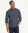 Model is wearing UNTUCKit Classic Cotton Fredonia Shirt in Navy Leaf Print.