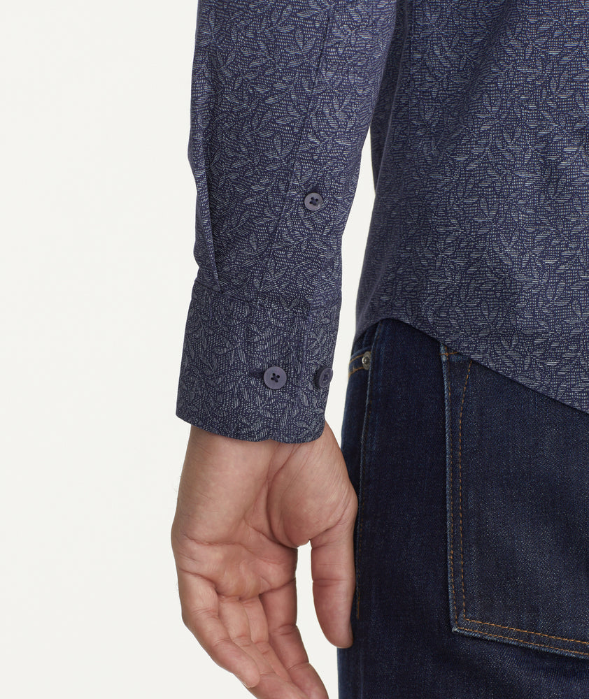 Model is wearing UNTUCKit Classic Cotton Fredonia Shirt in Navy Leaf Print.
