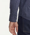 Model is wearing UNTUCKit Classic Cotton Fredonia Shirt in Navy Leaf Print.