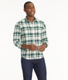 Model is wearing UNTUCKit Plaid Flannel Shirt in White Grounded With Green Plaid | Fair Trade Certified™.