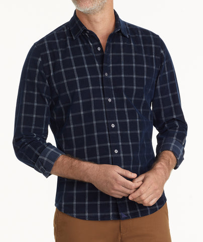 Model is wearing UNTUCKit Cord Shirt in Navy Windowpane | Fair Trade Certified™.