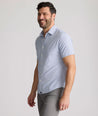 Model is wearing UNTUCKit Fuller performance shirt in dot print. 