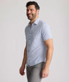 Model is wearing UNTUCKit Fuller performance shirt in dot print. 