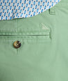 Model is wearing UNTUCKit 9" Stretch Chino Shorts in green. 