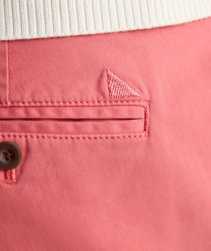 Model is wearing UNTUCKit 9" Stretch Chino Shorts in red. 