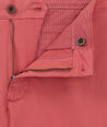 Model is wearing UNTUCKit 9" Stretch Chino Shorts in red. 