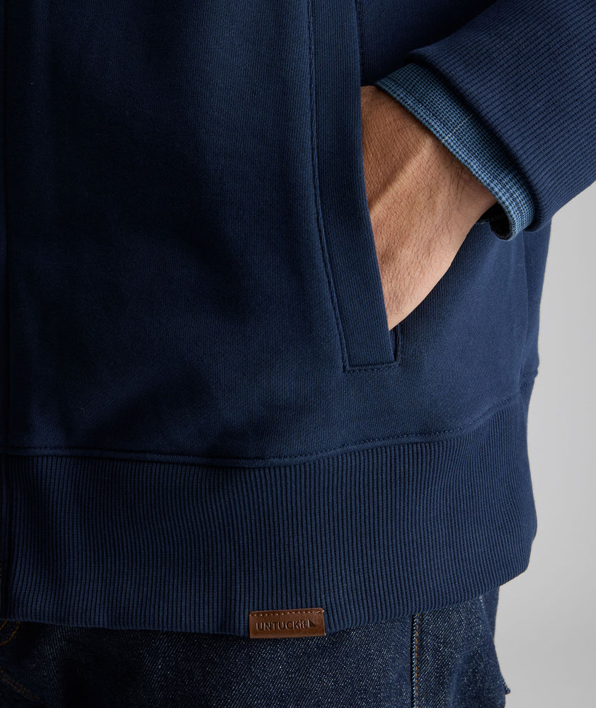 Model is wearing UNTUCKit French Terry Track Jacket. 