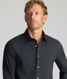 Model wearing an UNTUCKit Wrinkle-Free Gallis Shirt in black.