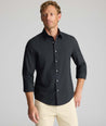 Model wearing an UNTUCKit Wrinkle-Free Gallis Shirt in black.