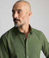 Model wearing an UNTUCKit Wrinkle-Free Gallis Shirt in green.