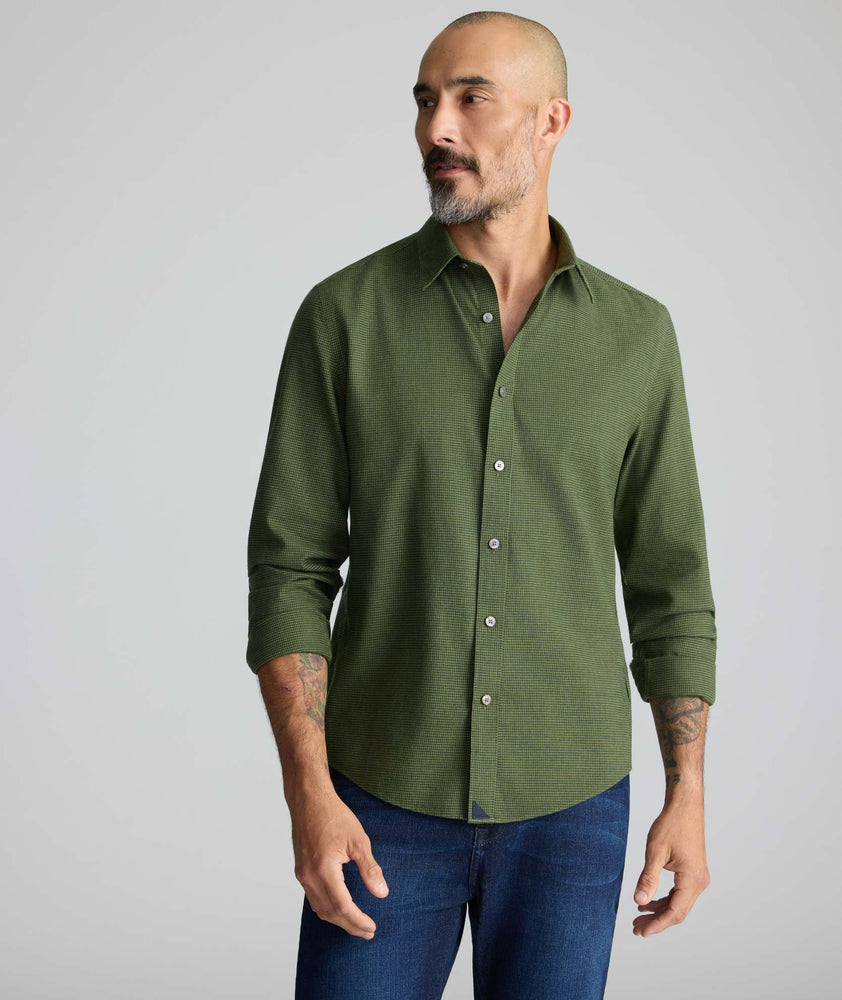 Model wearing an UNTUCKit Wrinkle-Free Gallis Shirt in green.