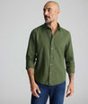 Model wearing an UNTUCKit Wrinkle-Free Gallis Shirt in green.