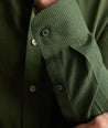 Model wearing an UNTUCKit Wrinkle-Free Gallis Shirt in green.