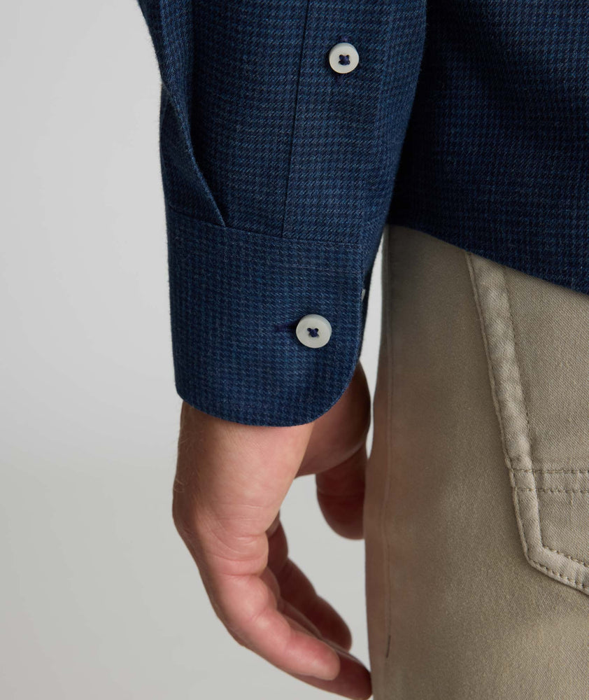 Model is wearing UNTUCKit Wrinkle-Free Gallis Shirt in navy. 