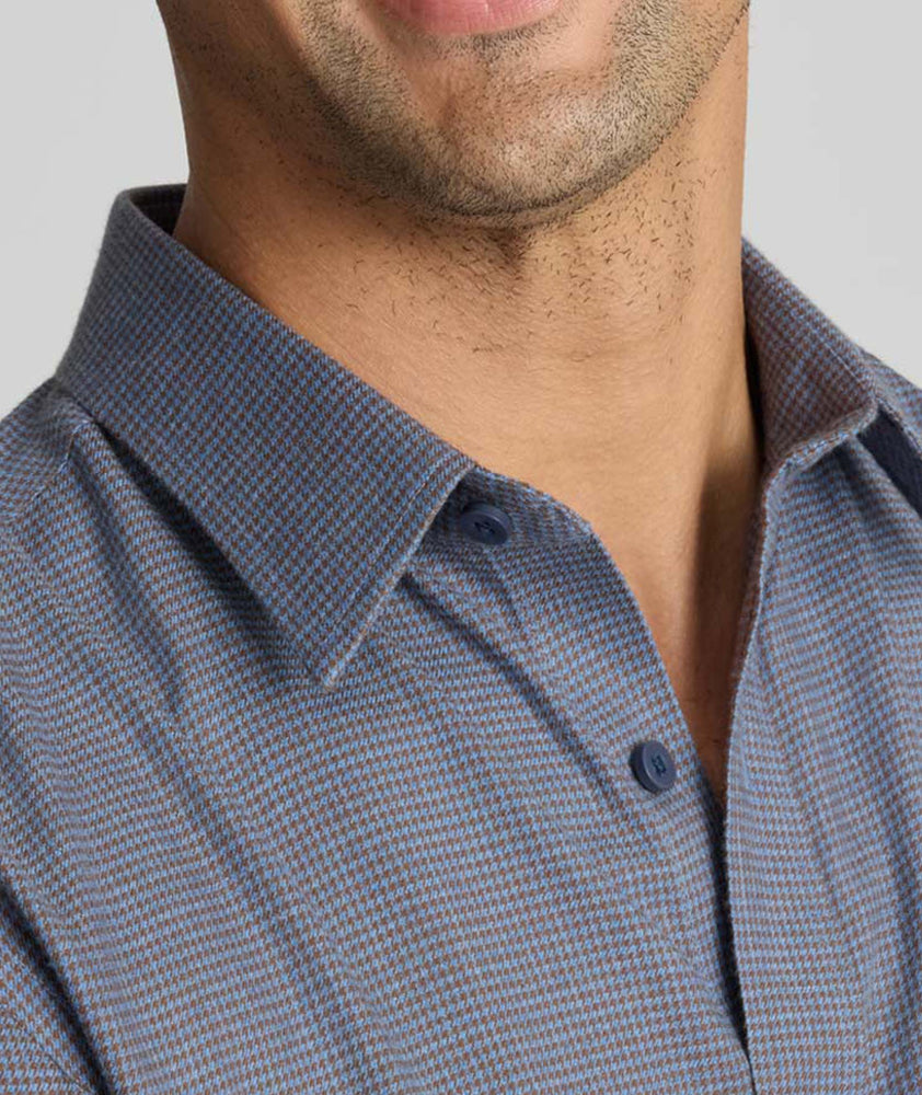 Model wearing an UNTUCKit Wrinkle-Free Gallis Shirt in grey.
