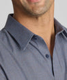 Model wearing an UNTUCKit Wrinkle-Free Gallis Shirt in grey.