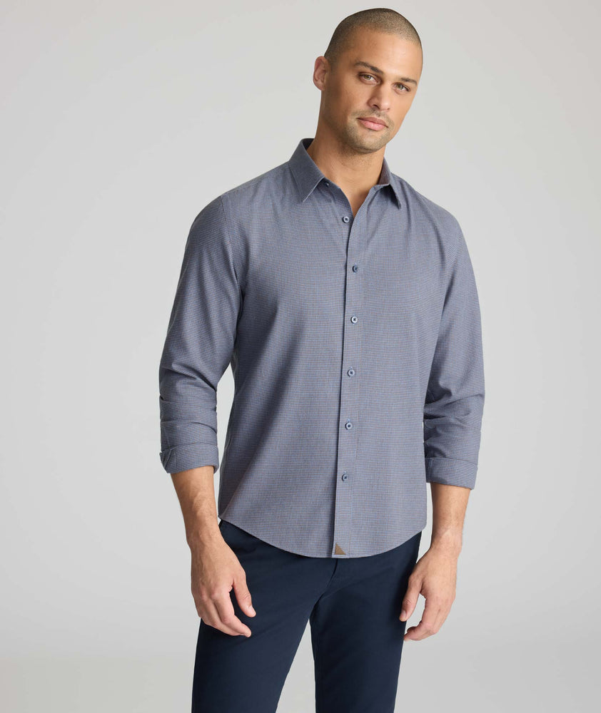 Model wearing an UNTUCKit Wrinkle-Free Gallis Shirt in grey.