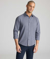 Model wearing an UNTUCKit Wrinkle-Free Gallis Shirt in grey.