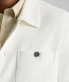 Model is wearing UNTUCKit Knit Overshirt in white. 