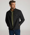 Model is wearing UNTUCKit Gardner jacket in black beauty. 