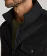 Model is wearing UNTUCKit Gardner jacket in black beauty. 