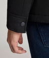 Model is wearing UNTUCKit Gardner jacket in black beauty. 