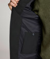 Model is wearing UNTUCKit Gardner jacket in black beauty. 