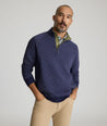 Model is wearing UNTUCKit Garrison pullover in blue. 