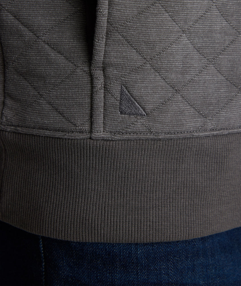 Model is wearing UNTUCKit Garrison pullover in forged iron. 