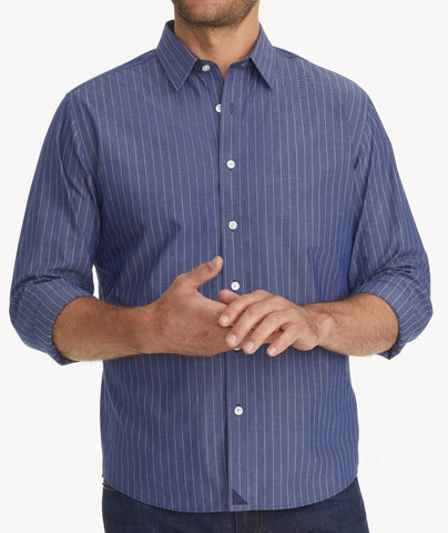 Model is wearing UNTUCKit Wrinkle-Free Gifford Shirt in Blue & White Stripe.