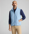Model wearing a blue packable vest.