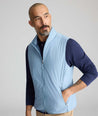Model wearing a blue packable vest.