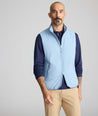 Model wearing a blue packable vest.