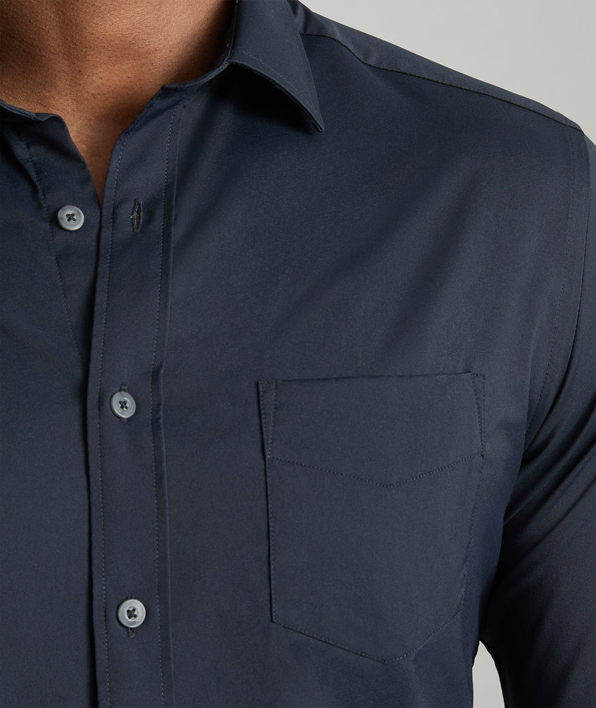 Model is wearing UNTUCKit gironde shirt in black. 
