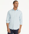 Model is wearing UNTUCKit Wrinkle-Free Performance Gironde Shirt in Light Blue.