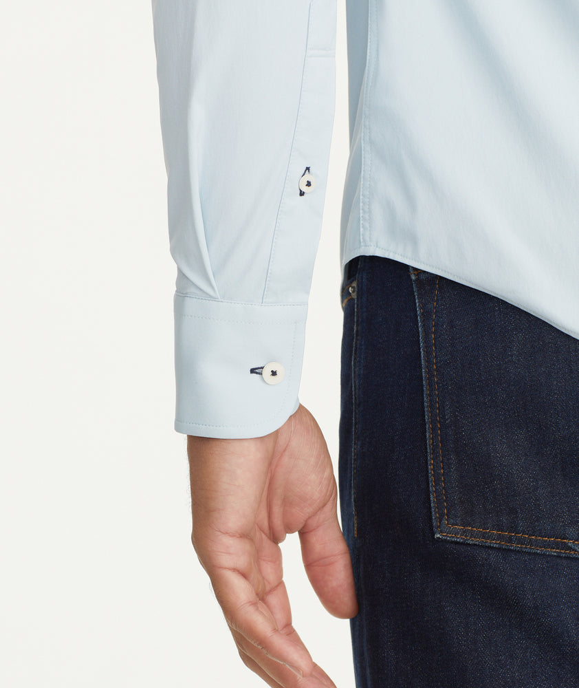 Model is wearing UNTUCKit Wrinkle-Free Performance Gironde Shirt in Light Blue.