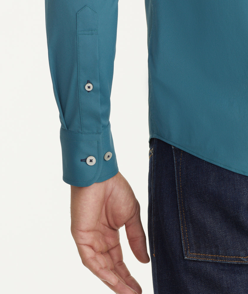 Model is wearing UNTUCKit Wrinkle-Free Performance Gironde Shirt in Deep Green.