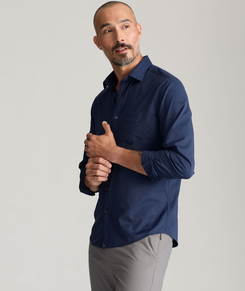 Model is wearing UNTUCKit Gironde in navy. 