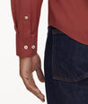 Model is wearing UNTUCKit Wrinkle-Free Performance Gironde Shirt in fired brick.