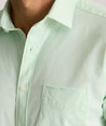 Model is wearing UNTUCKit Gironde short sleeve performance  shirt in bright green. 