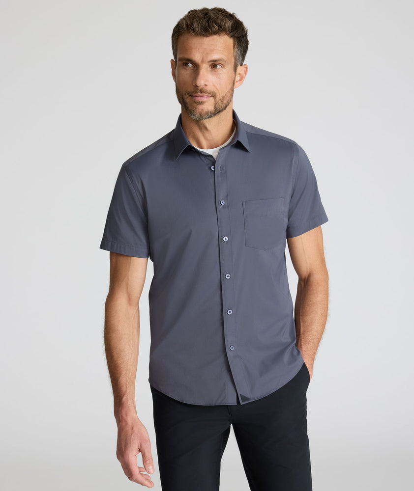 Model is wearing UNTUCKit Performance Short-Sleeve Grionde Shirt.