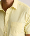 Model is wearing UNTUCKit Gironde short sleeve performance  shirt in light yellow. 