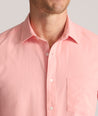 Model is wearing UNTUCKit Performance Gironde Shirt in pink.