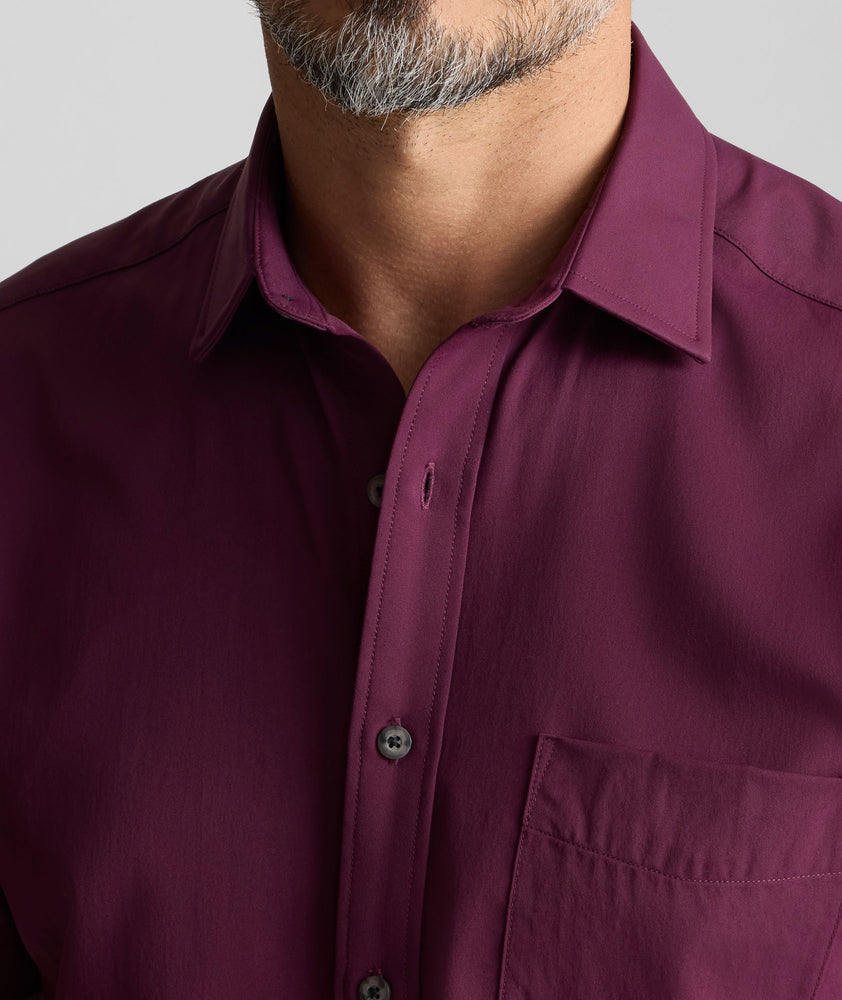 Model is wearing UNTUCKit Performance Gironde Shirt in fig. 