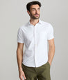 Model wearing an UNTUCKit White Wrinkle-Free Performance Short Sleeve Gironde Shirt