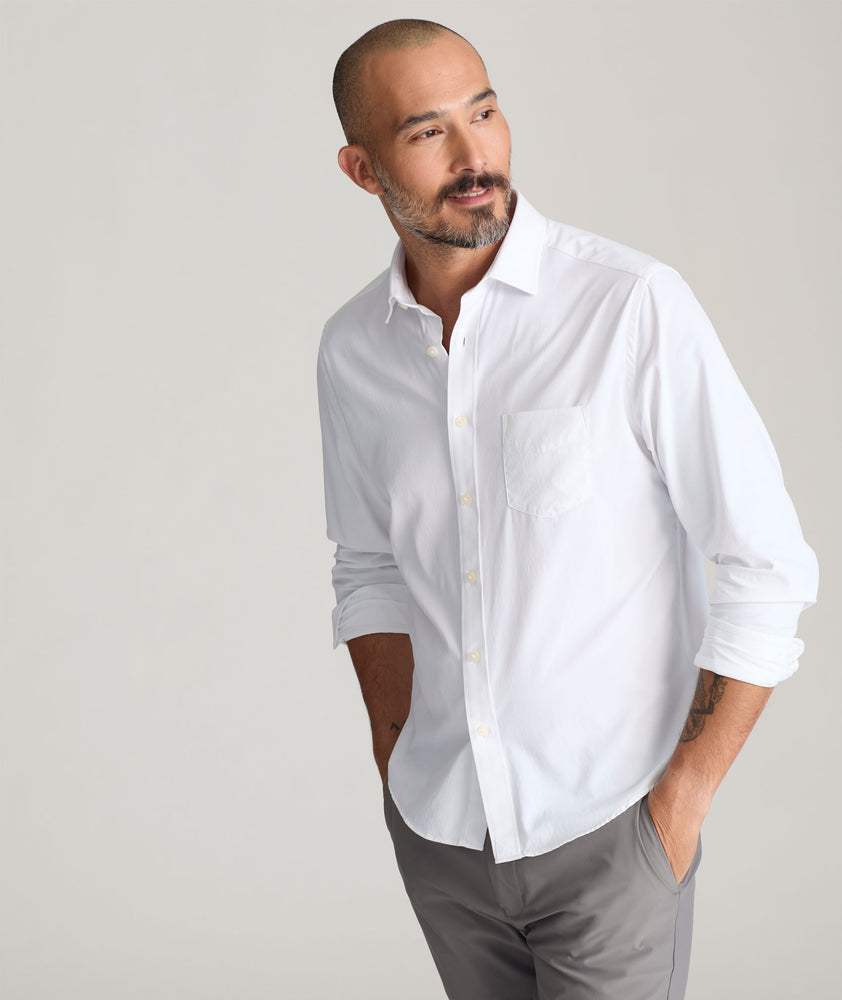 Model is wearing UNTUCKit Gironde shirt in white.