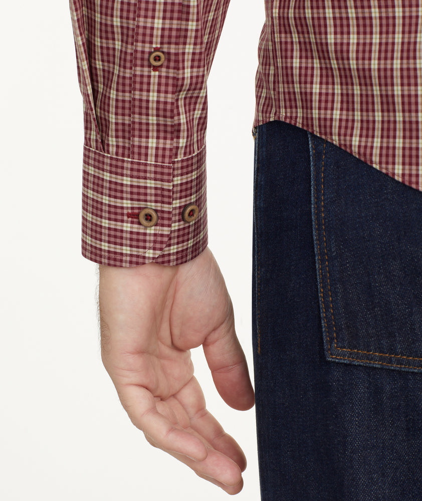 Model is wearing UNTUCKit Wrinkle-Free Gisborne Shirt in Maroon & Gold Check.